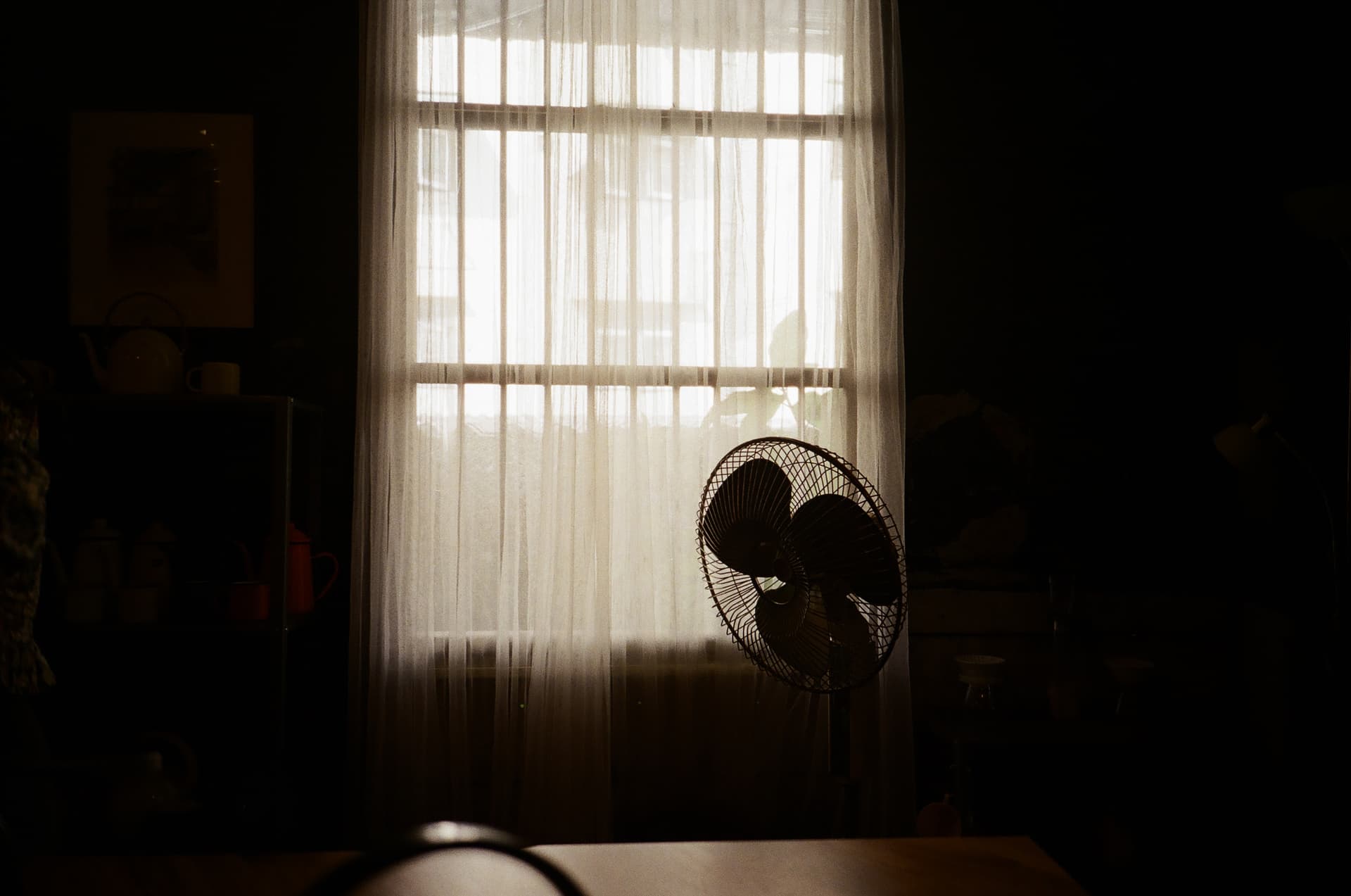 Solitude in Stillness: A Study of Table, Fan, Curtain, and Window'